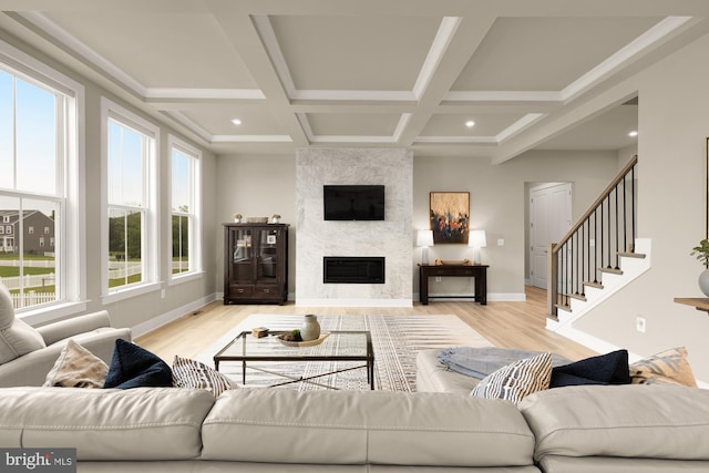 15613 Althea Ln, Gainesville, VA 20155 - living area featuring wood finished floors, a fireplace, beamed ceiling, coffered ceiling, and baseboards