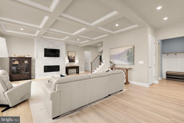 15613 Althea Ln, Gainesville, VA 20155 - living room with light wood finished floors, baseboards, beamed ceiling, stairs, and a large fireplace