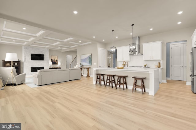 15613 Althea Ln, Gainesville, VA 20155 - living area with recessed lighting, light wood-type flooring, baseboards, coffered ceiling, and a large fireplace