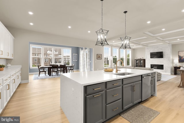15613 Althea Ln, Gainesville, VA 20155 - kitchen featuring a sink, stainless steel dishwasher, white cabinets, recessed lighting, and light countertops