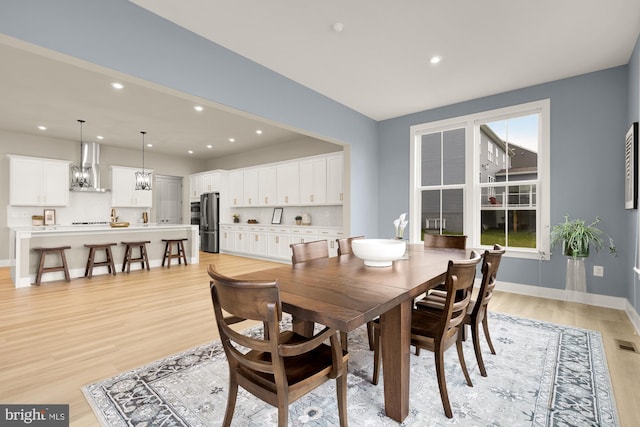 15613 Althea Ln, Gainesville, VA 20155 - dining room featuring light wood-type flooring, recessed lighting, and baseboards