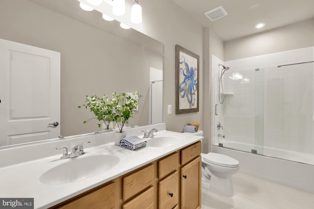 15613 Althea Ln, Gainesville, VA 20155 - bathroom featuring double vanity, combined bath / shower with glass door, and toilet