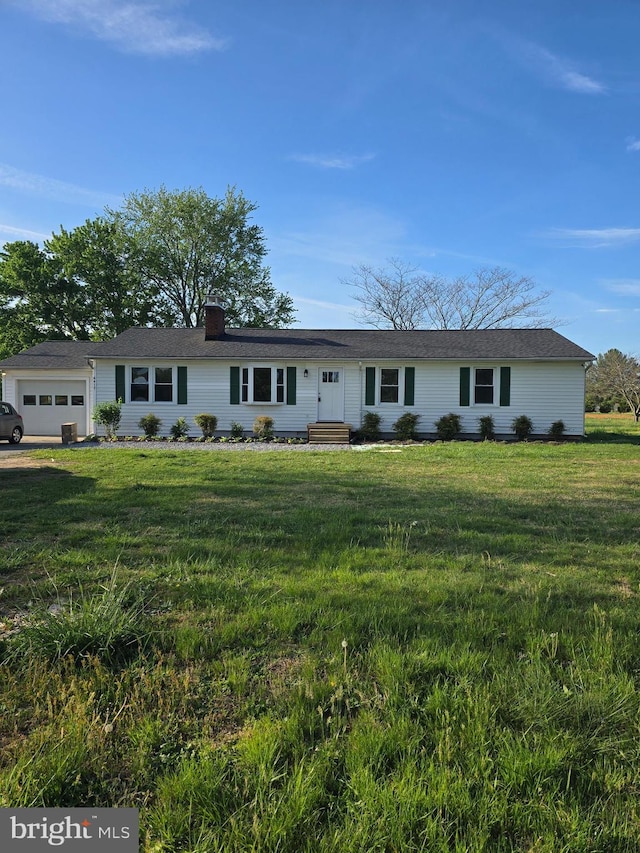 single story home with a front lawn, entry steps, an attached garage, and a chimney