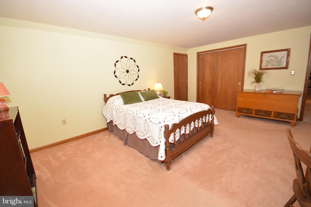 carpeted bedroom featuring baseboards