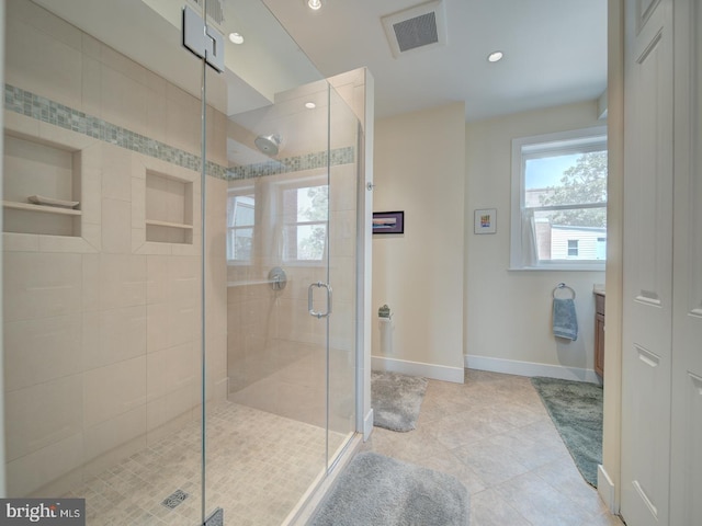 bathroom featuring visible vents, recessed lighting, baseboards, and a shower stall