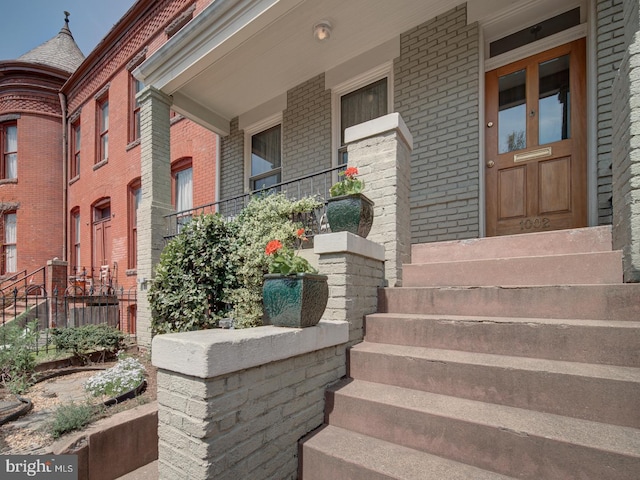 property entrance with brick siding