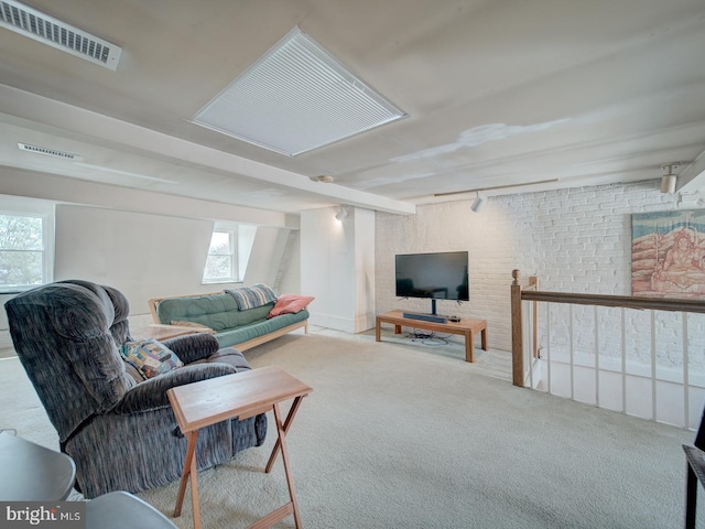 living room with a healthy amount of sunlight, carpet, and visible vents