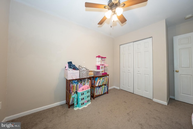 rec room with baseboards, a ceiling fan, and carpet flooring