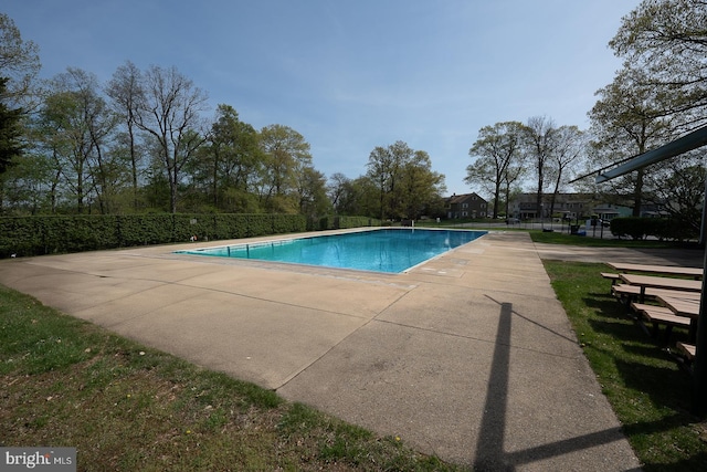 pool featuring a patio and fence