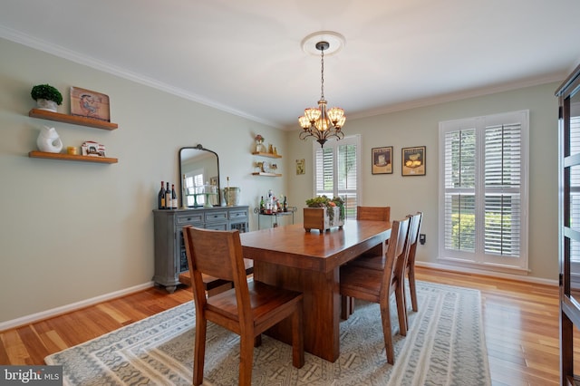 7228 Devereux Ct, Alexandria, VA 22315 - dining area with a chandelier, ornamental molding, light wood-type flooring, and baseboards