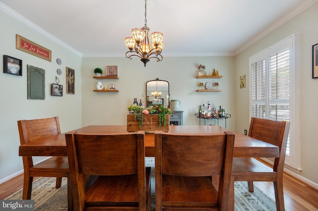 7228 Devereux Ct, Alexandria, VA 22315 - dining room with a chandelier, wood finished floors, ornamental molding, and baseboards