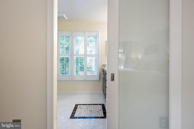 7228 Devereux Ct, Alexandria, VA 22315 - bathroom featuring tile patterned floors, baseboards, vanity, inlaid floor details, and a shower