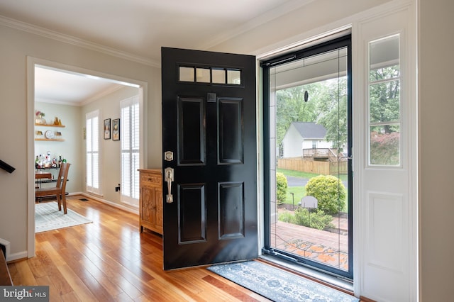 7228 Devereux Ct, Alexandria, VA 22315 - entrance foyer featuring light wood finished floors, crown molding, healthy amount of natural light, and baseboards