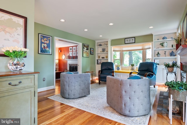 7228 Devereux Ct, Alexandria, VA 22315 - living room featuring a fireplace, light wood-type flooring, recessed lighting, and baseboards