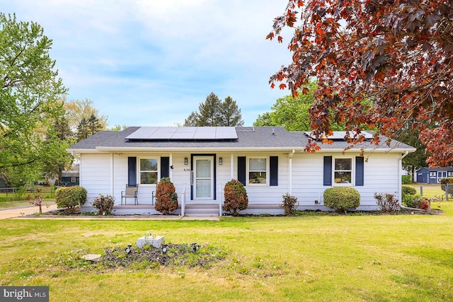 4290 S State St, Camden Wyoming, DE 19934 - single story home with solar panels, a shingled roof, a porch, and a front yard