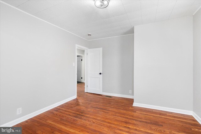 6217 Burgess Ave, Baltimore, MD 21214 - spare room with visible vents, baseboards, and wood finished floors