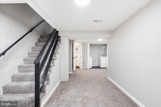 6217 Burgess Ave, Baltimore, MD 21214 - stairs with baseboards, visible vents, washer / clothes dryer, and carpet flooring