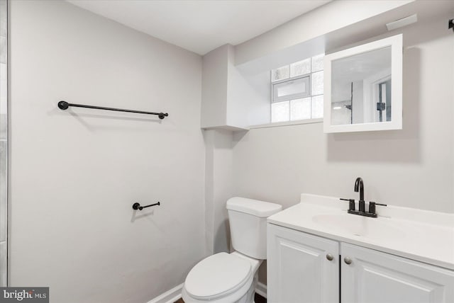 6217 Burgess Ave, Baltimore, MD 21214 - bathroom featuring baseboards, vanity, and toilet