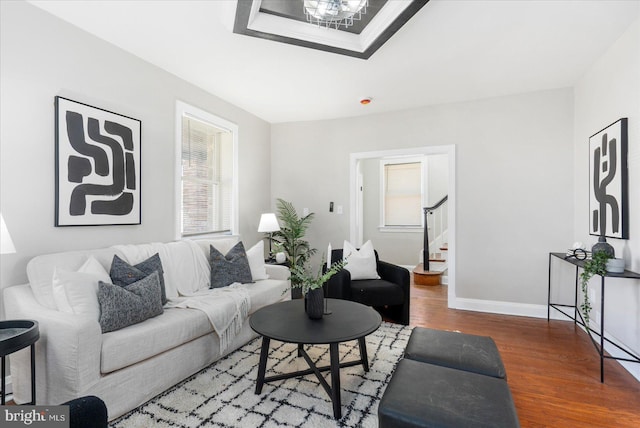 6217 Burgess Ave, Baltimore, MD 21214 - living room featuring baseboards, wood finished floors, and stairs