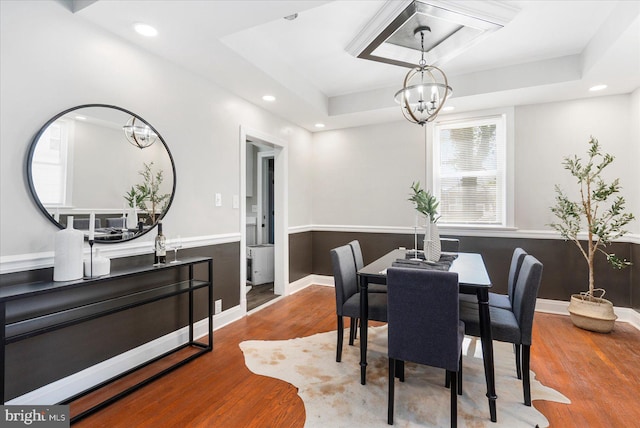 6217 Burgess Ave, Baltimore, MD 21214 - dining area featuring wood finished floors, an inviting chandelier, a tray ceiling, baseboards, and recessed lighting