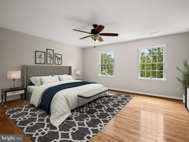 13148 Isle Of Mann Way, Highland, MD 20777 - bedroom with wood finished floors, baseboards, and ceiling fan