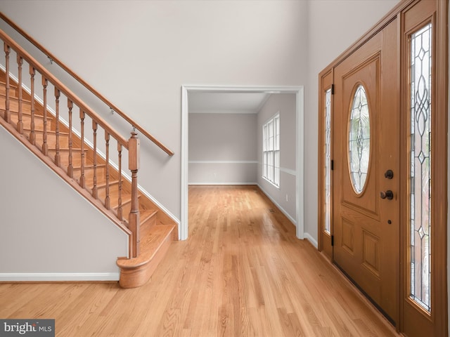 13148 Isle Of Mann Way, Highland, MD 20777 - foyer entrance with wood finished floors, stairway, and baseboards