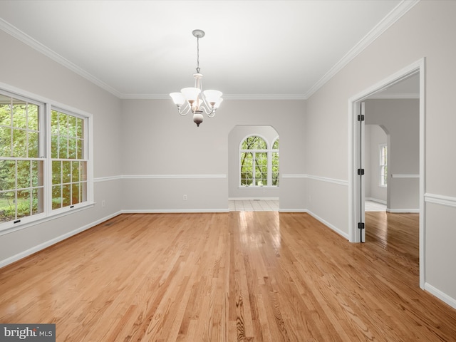 13148 Isle Of Mann Way, Highland, MD 20777 - spare room with a chandelier, arched walkways, light wood-style flooring, ornamental molding, and baseboards