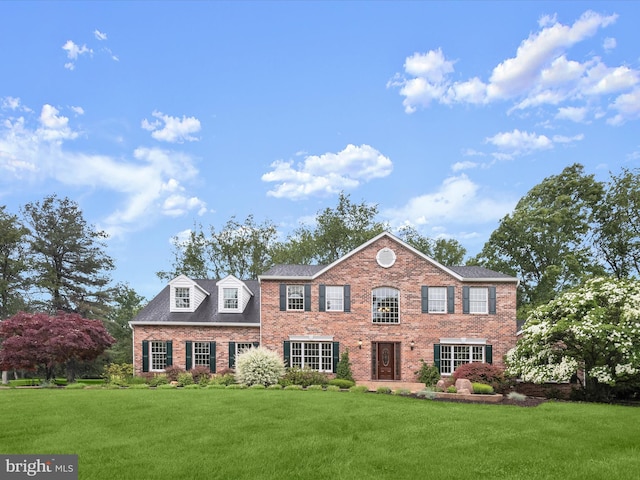 13148 Isle Of Mann Way, Highland, MD 20777 - view of front facade with brick siding and a front lawn