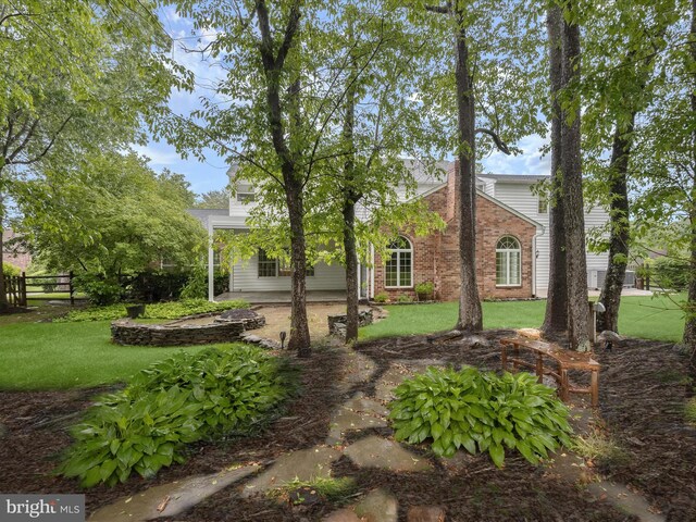 13148 Isle Of Mann Way, Highland, MD 20777 - view of front facade with a patio area and brick siding