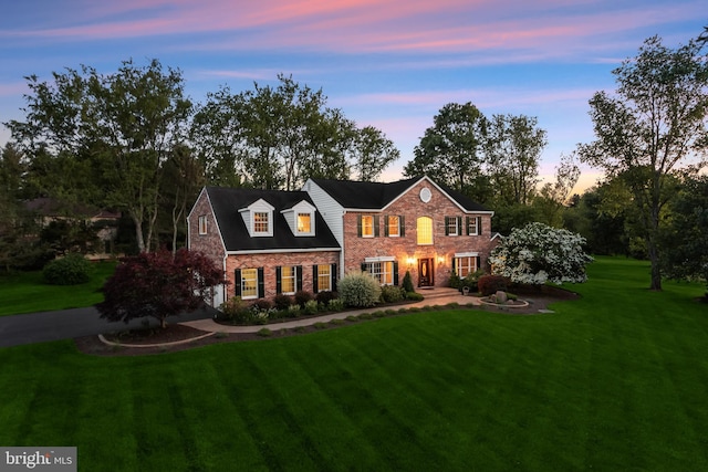 13148 Isle Of Mann Way, Highland, MD 20777 - view of front of house with a front yard and brick siding
