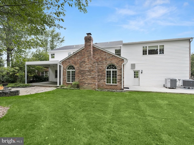 13148 Isle Of Mann Way, Highland, MD 20777 - back of house with central air condition unit, a chimney, and a patio area