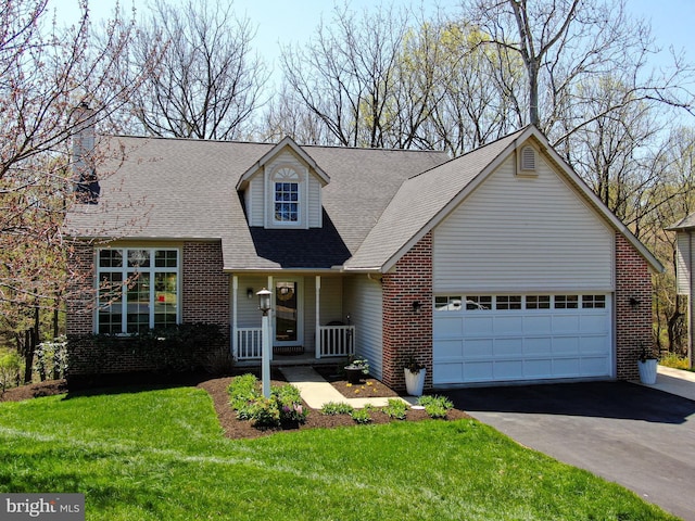 cape cod-style house featuring a garage, a front lawn, brick siding, a shingled roof, and driveway