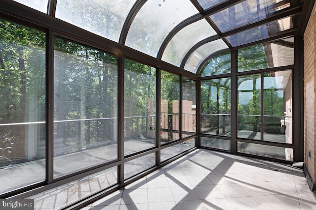 unfurnished sunroom featuring plenty of natural light
