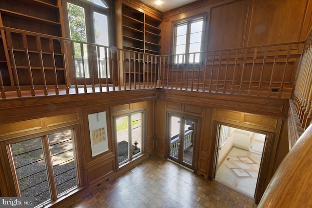 doorway to outside with a high ceiling