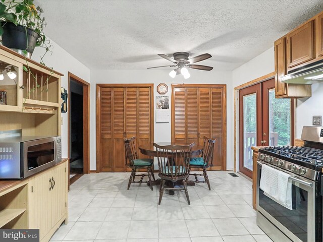 427 Oak Dale Ct, Capon Bridge, WV 26711 - dining space with french doors, a ceiling fan, and a textured ceiling