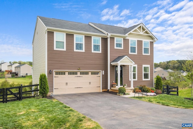 view of front of home featuring fence, an attached garage, a front lawn, and aphalt driveway