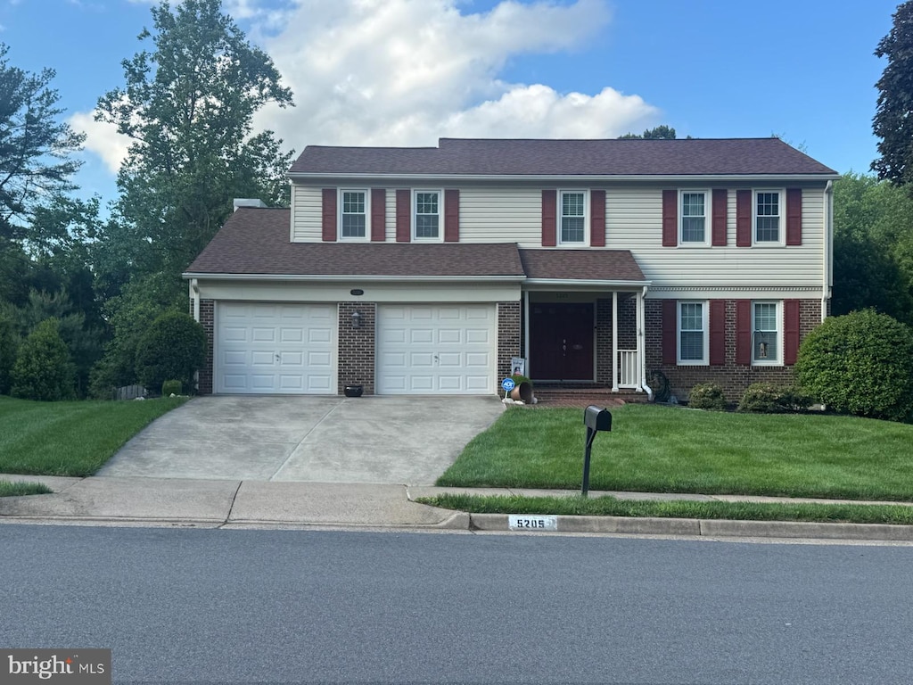 5205 Dunleigh Dr, Burke, VA 22015 - view of front of property with brick siding, driveway, a front lawn, and a garage