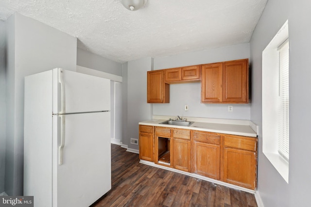1714 Abbotston St, Baltimore, MD 21218 - kitchen with freestanding refrigerator, a sink, dark wood-style flooring, light countertops, and baseboards
