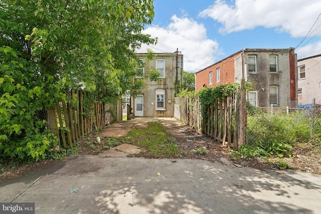 1714 Abbotston St, Baltimore, MD 21218 - rear view of house with fence and stucco siding