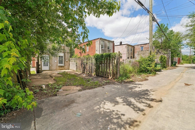 1714 Abbotston St, Baltimore, MD 21218 - view of front facade with fence and stucco siding