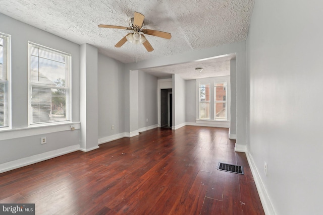 1714 Abbotston St, Baltimore, MD 21218 - unfurnished living room featuring wood-type flooring, a textured ceiling, baseboards, and ceiling fan
