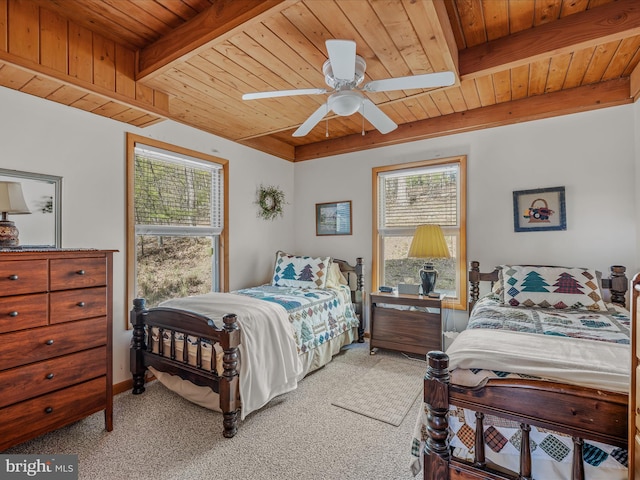 bedroom with carpet floors, a ceiling fan, wooden ceiling, and beamed ceiling