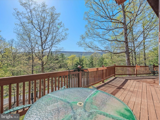 wooden deck with outdoor dining space