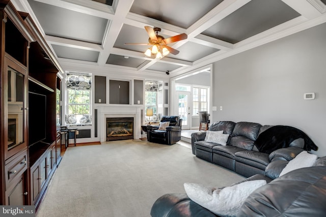6041 Clairemont Dr, Owings, MD 20736 - living area with coffered ceiling, beam ceiling, a glass covered fireplace, light colored carpet, and ceiling fan