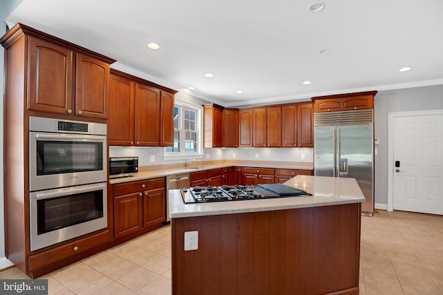 6041 Clairemont Dr, Owings, MD 20736 - kitchen with appliances with stainless steel finishes, crown molding, light countertops, and light tile patterned floors