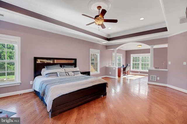 6041 Clairemont Dr, Owings, MD 20736 - bedroom featuring light wood-style flooring, decorative columns, visible vents, baseboards, and ornamental molding
