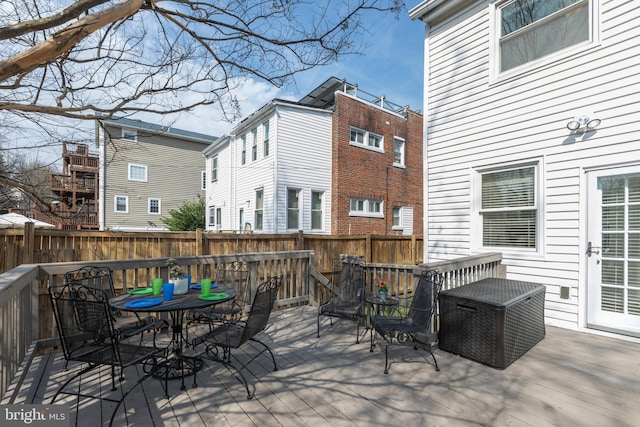 deck featuring fence and outdoor dining area