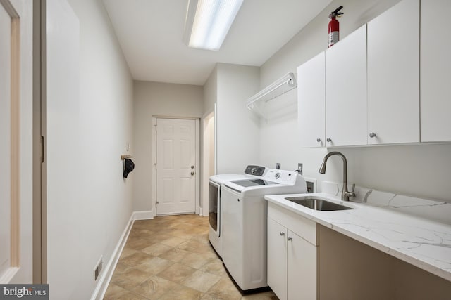 6530 Heather Brook Ct, Mclean, VA 22101 - laundry room with visible vents, cabinet space, a sink, baseboards, and washer and dryer