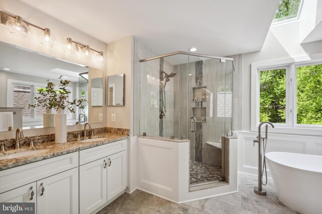 6530 Heather Brook Ct, Mclean, VA 22101 - bathroom with a freestanding tub, a shower stall, and a sink