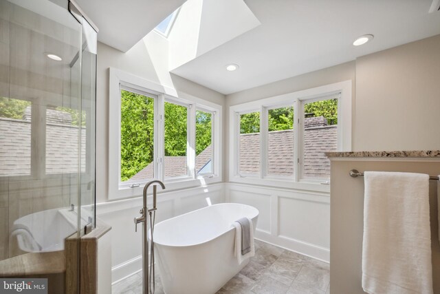 6530 Heather Brook Ct, Mclean, VA 22101 - full bathroom with recessed lighting, a soaking tub, a decorative wall, and a shower stall